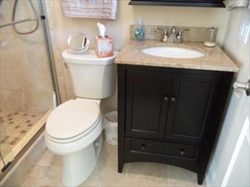 a bathroom with a toilet and a sink and a shower at 16351 Hesser - 3br 2 Ba Home in Beach Haven Gardens