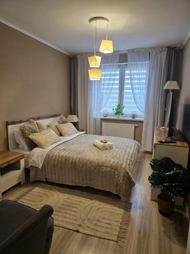Giường trong phòng chung tại 2 Bed Apartment in Zyrardow