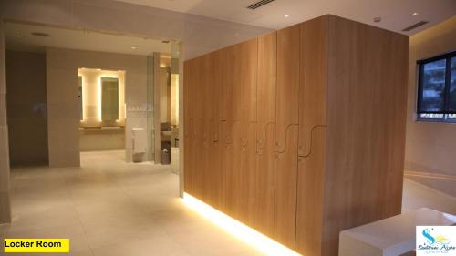 a locker room with a row of lockers at Azure Urban Resort Residences in Manila