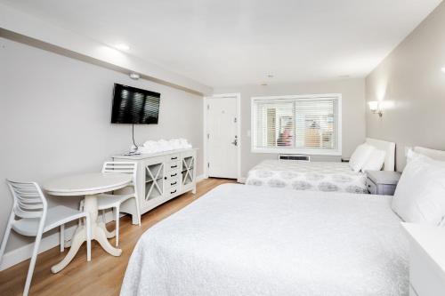 Ένα ή περισσότερα κρεβάτια σε δωμάτιο στο The Atlantic Motel
