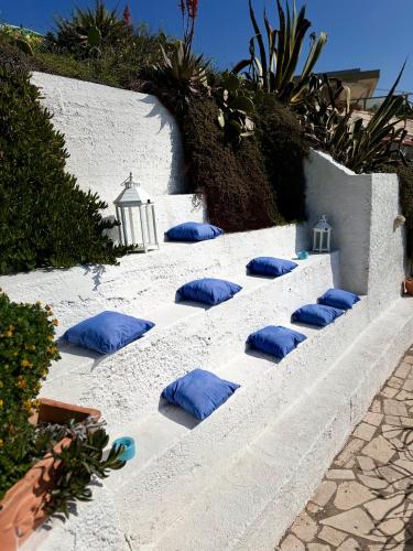 a group of blue pillows sitting on a staircase at Golden Home in Anzio