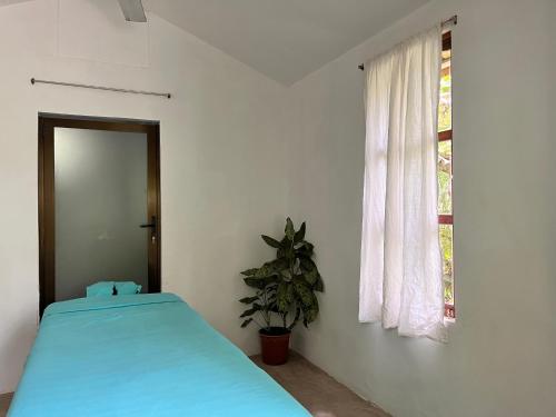 Postel nebo postele na pokoji v ubytování Cabinas Jacaranda