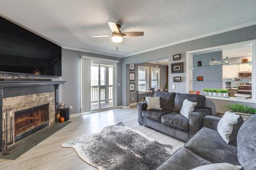 a living room with a couch and a fireplace at 2 Mi to Skiing! Beech Mtn Condo with Resort Perks in Beech Mountain