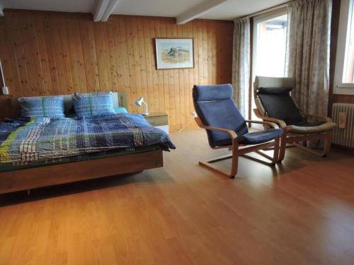 En eller flere senger på et rom på Chalet Bellevue Berg- und Seesicht