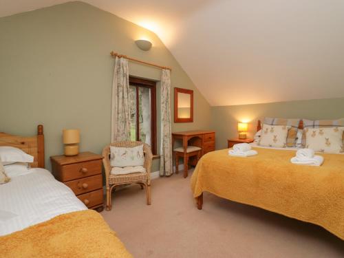 Ένα ή περισσότερα κρεβάτια σε δωμάτιο στο Winder Barn