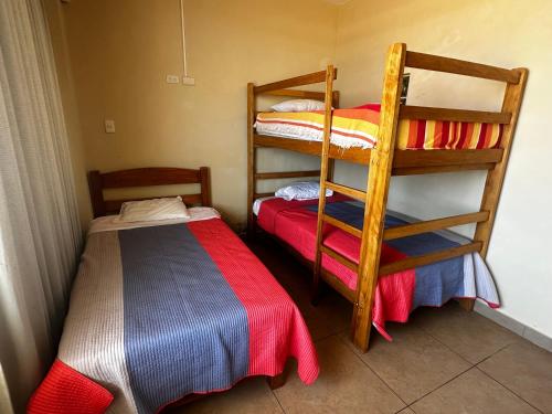 Ένα ή περισσότερα κρεβάτια σε δωμάτιο στο YOLO House Peru