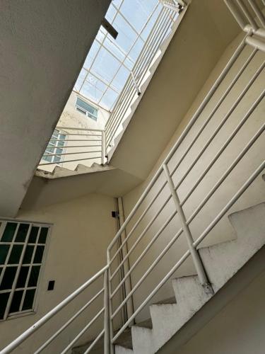 a skylight in the ceiling of a building with stairs at PEDRERA 39 in San Felipe Hueyotlipan