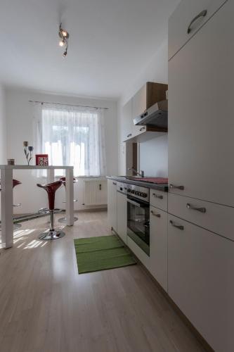 Kuchyň nebo kuchyňský kout v ubytování Flataid Apartment Elisabethinergasse