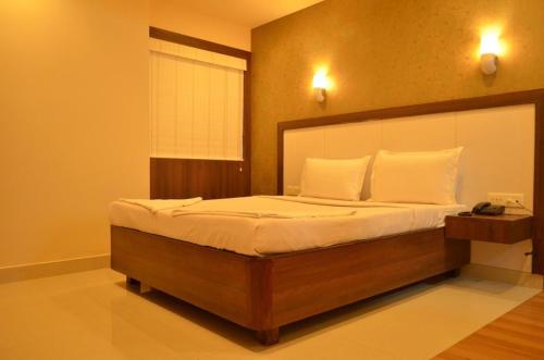 Llit o llits en una habitació de Balaji Residency