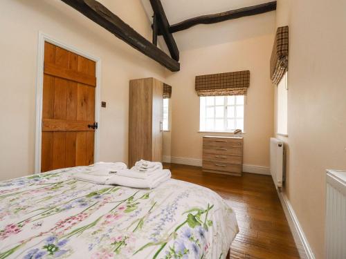 a bedroom with a large bed and a wooden door at Balloo in Lancaster