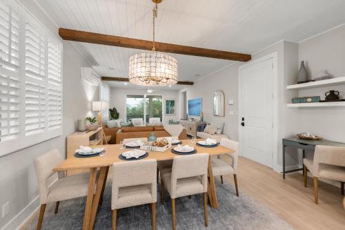 a dining room and living room with a table and chairs at Shore To Escape at Hunter's Point in Cortez