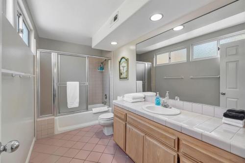 a bathroom with a sink and a toilet and a shower at OCEAN FRONT - STUNNING VIEWS- VACATION PARADISE!! in Dana Point