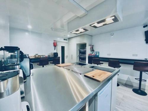 a large kitchen with a counter top in a room at Apt 03 Beachside Beauty Central Studio Steps from Cafes in Brighton & Hove
