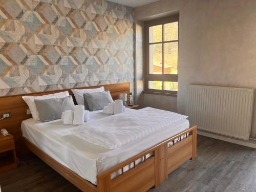 Un pat sau paturi într-o cameră la Hotel Lido