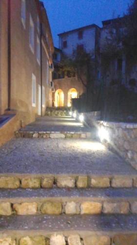 a group of stone steps with lights on them at La Locanda del Curato Rooms in Lentiscosa