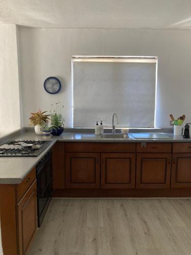 a kitchen with a sink and a counter top at Cerca de todo en San Jerónimo in Monterrey