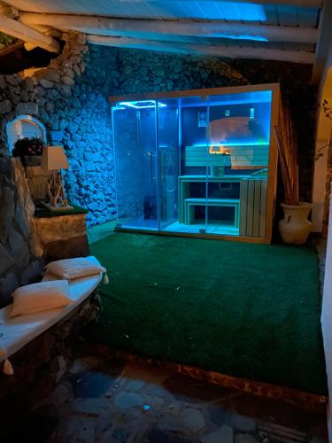 a bathroom with a glass shower in a room at Maison Du Reve Scario in Scario