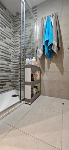 a bathroom with a shower and a walk in shower at Happy Place Apartament in Arenales del Sol