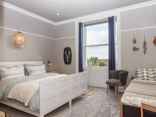 En eller flere senge i et værelse på Barnsley House