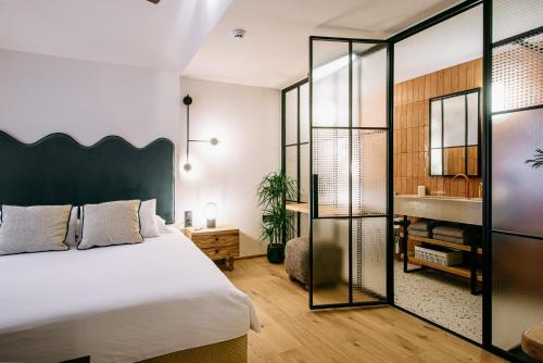 a bedroom with a bed and a sink at 7oaks Noble House in Dubrovnik