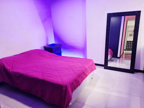 A bed or beds in a room at Apartamento en Ciudad Del Rio El Poblado Medellin