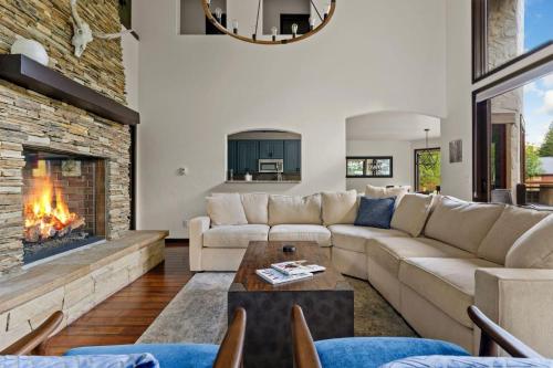 a living room with a couch and a fireplace at 4501 Spruce Way in Mid Vail