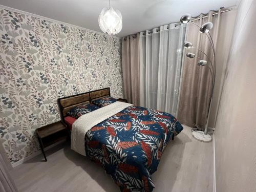 Katil atau katil-katil dalam bilik di Meudon appartement confort 10 minutes de Paris