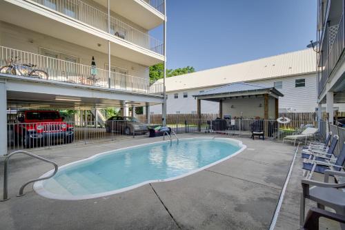 a swimming pool in the middle of a building at Relaxing Biloxi Vacation Rental Condo Near Beach! in Biloxi