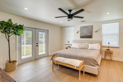 a bedroom with a bed and a ceiling fan at Naples Duplex Home with Private Pool and Lanai! in Naples