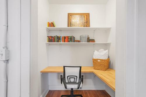 a desk in a room with a chair at Library Square Suites in Toledo