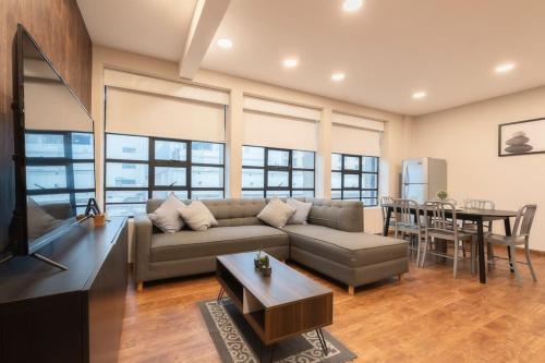 a living room with a couch and a table at 401 Location 3Bdrm 2bath apt with AC Rooftop in Mexico City