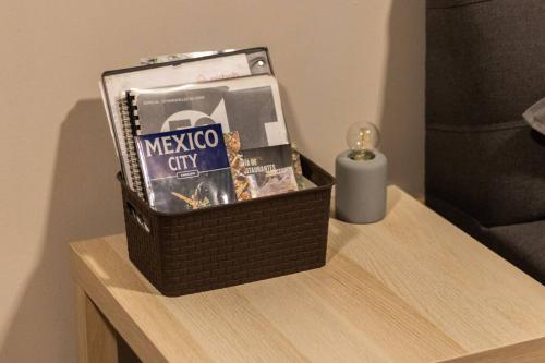a basket of snacks on a table with a candle at 503 Walk the City Center 1Bdrm 1 bath AC Rooftop in Mexico City