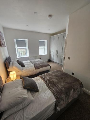 a bedroom with three beds in a room at Number33 in Galway