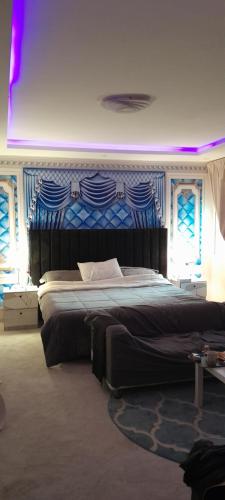 a bedroom with a large bed in a room at العليا in Riyadh