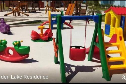 a playground with many different types of play equipment at Apartamento Arraial do Cabo in Arraial do Cabo