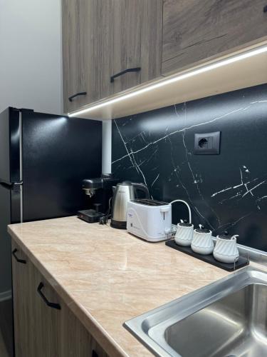 Kuchyň nebo kuchyňský kout v ubytování AM Apartment Tirana