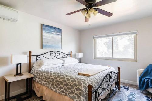 a bedroom with a bed and a ceiling fan at Casa Italia -2BR- FREE Driveway parking for 2 cars in San Diego