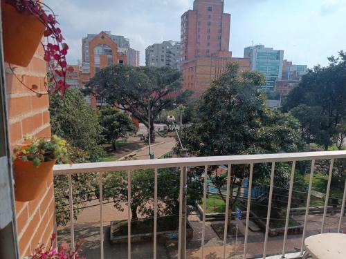 a balcony with a view of a city at Apartamento con balcón Javeriana in Bogotá