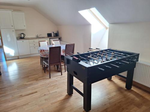 a large game table in a room with a dining room at The Attic in Kilkenny