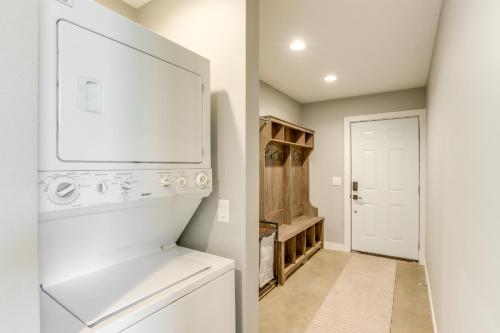 a kitchen with a washer and dryer and a laundry room at Modern Oskaloosa Cabin with 2 Acres and On-Site Trails in Oskaloosa