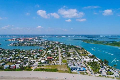 an aerial view of a beach and the water at Modern and comfortable new home with hot tub in Fort Pierce