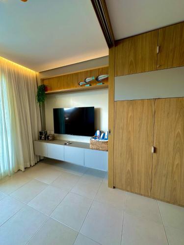 TV a/nebo společenská místnost v ubytování Flat Eco Resort Praia Dos Carneiros