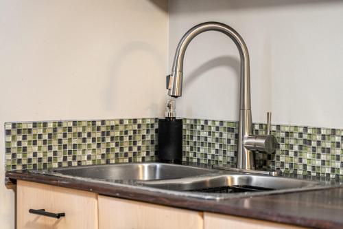 a stainless steel sink in a kitchen at The Bohemian in Red Deer