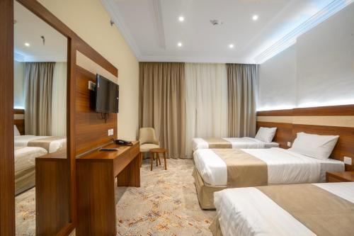 Karam Hotel tesisinde bir odada yatak veya yataklar