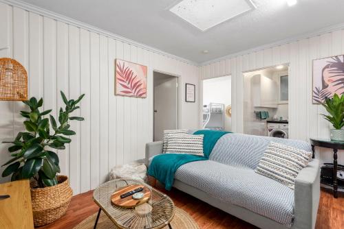 a living room with a couch and a table at MOANA I Walk to Beach & River in Ocean Grove