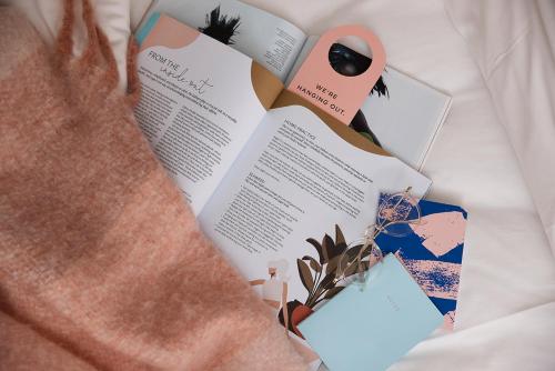 a book sitting on top of a bed at The Ultimo in Sydney
