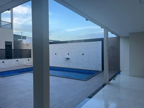 a view of a swimming pool from a house at Casa dos Belfort in Barreiras