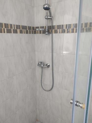 a bathroom with a shower with a glass door at Apartments with parking space Rabac, Labin - 6414 in Rabac