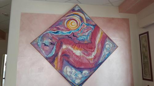 a painting on the wall of a room at Hotel Atlantic in Gatteo a Mare