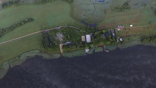 an overhead view of a farm with a road at Sodyba Brazylija in Taraldžiai